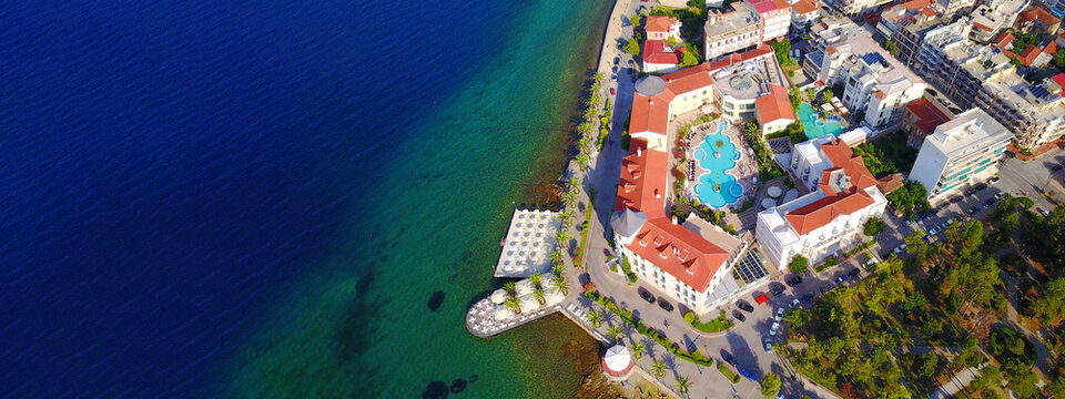 Aerial drone ultra wide photo of famous seaside village well known for thermal springs of Aidipsos, North Evia island, Greece