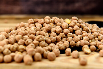 Organic chickpeas in a light wooden table