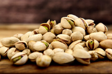 Organic pistachio on a dark wooden board