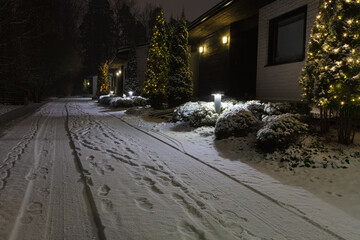 Houses in the suburbs. Winter in Finland Street and houses covered with beautiful snow Evening photo