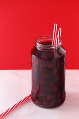 Cherry compote in a glass jar