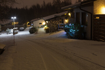 Houses in the suburbs. Winter in Finland Street and houses covered with beautiful snow Evening photo