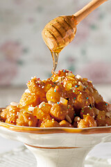 Struffoli with pinoli adn sugar granes with honey