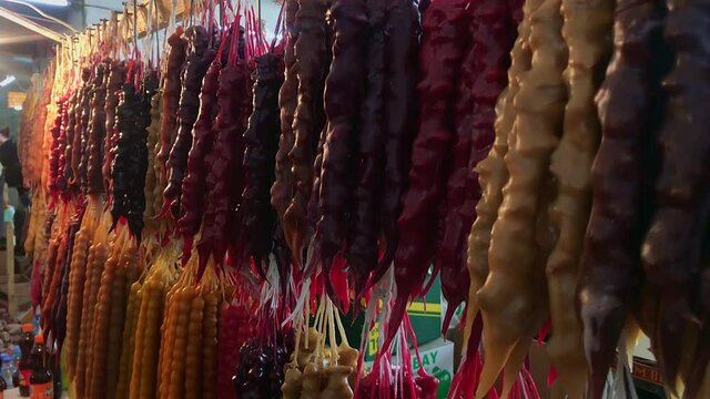 15th february, 2020. Tbilisi. Georgia.Traditional georgian candy hanging on display in grocery market