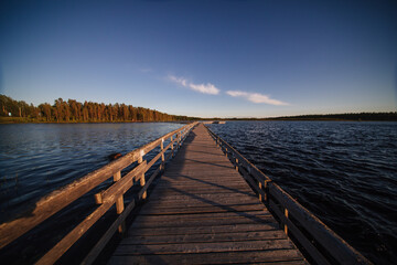 Wooden path road on lake in Finland