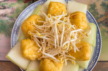 Fried tofu with bean sprouts and vegetables