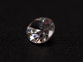 Close up shoot of group of sparkling diamonds, shoot on black leather as background