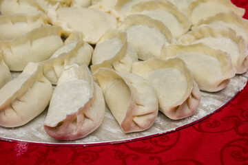 Raw, uncooked homemade chinese dumplings