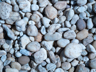 pebbles on the beach, white stone background