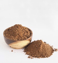 Palm kernel meal powder with shell by product from oil production and substrate of cosmetic on isolate background