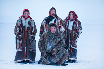 Yamalo-Nenets Autonomous Okrug, extreme north, Nenets family in the national winter clothes of the northern inhabitants of the tundra, the Arctic circle