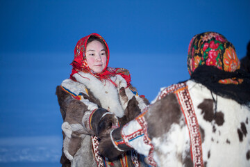 Yamalo-Nenets Autonomous Okrug, extreme north, Nenets family in the national winter clothes of the northern inhabitants of the tundra, the Arctic circle