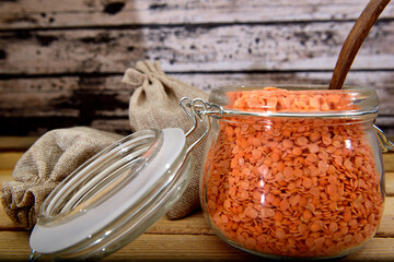 Organic red Lentils on a glass jar