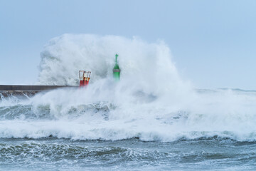 Swell in the Cantabrian Sea in the area of the Buoy Lighthouse of La Barra de San Vicente de la Barquera, at the mouth of the port. Oyambre Natural Park, Cantabria, Spain, Europe