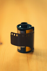 35mm negative camera film on a wooden background