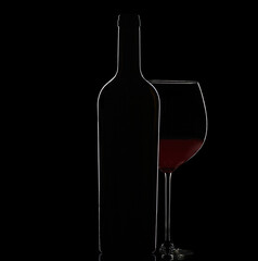 Rimmedlight on a bottle and a glass of red wine