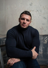 Muscled model in sweater