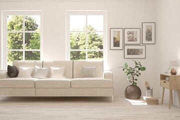 White living room with sofa and summer landscape in window. Scandinavian interior design. 3D illustration