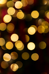 Golden glowing bokeh background. Abstract bright led light backgdrop. Defocused image
