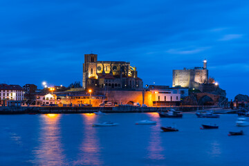 Castro Urdiales old town at dusk, with Santa Ana Church and Castillo Lighthouse, Cantabria, Spain, Europe