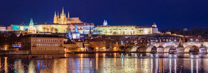 Tuinposter Amazing panoramic view on Prague Castle, St Vitus Cathedral and Charles Bridge with reflection of lights in Vltava river. Old town, Czech Republic © vladim_ka