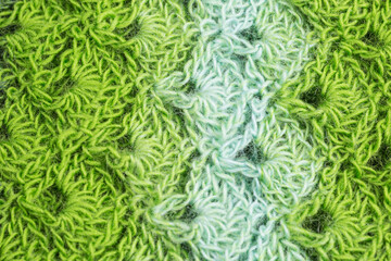 handmade multicolor crochet background in shades of green with double crochet stitches - 402835974