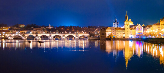 Fototapeta na wymiar Charles Bridge and Karlovy Lazne at night lights in Prague, Czech Republic.