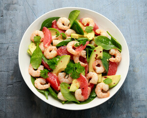Fresh Avocado Grapefruit shrimp salad in white plate