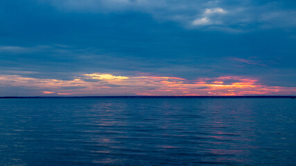 Fototapeta na wymiar Sunset at the beach and evening sky