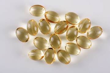 Vitamin D capsules on white background. Omega 3.