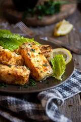 Cooked fish fillet with lemon and vegetables