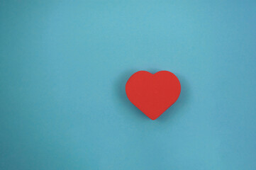 one red heart on a blue background