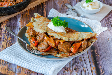 Hungarian goulash with potato pancake