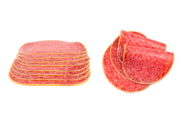 Salami slices isolated on white background.