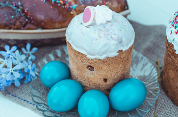 Easter eggs with Easter, flowers and a wicker basket. Religious holidays concept