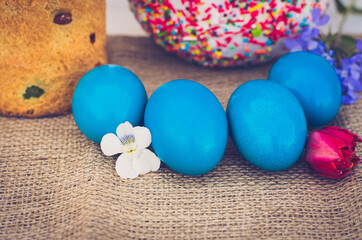 Obraz na płótnie Canvas Easter eggs with Easter and flowers close-up.