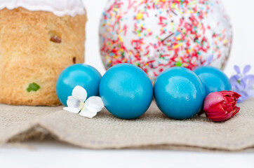 Easter eggs with Easter and flowers close-up.