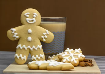 Fotobehang Gingerbread man met glaasje cappuccino en koekjes © Albert Ziganshin