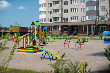 Fototapeta na wymiar Playground in the yard. Production of apartments, social housing.