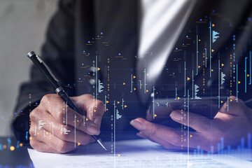 Businesswoman in formal wear is signing the contract to invest money in stock market. Internet trading and wealth management. Checking the details of transaction at smart phone. Forex