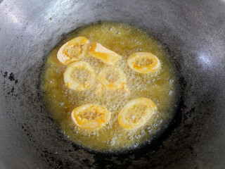 Squid cut into small pieces and fried with flour. The flour has been mixed with eggs to add flavour and to make it crisper.