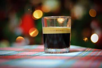 Cup of italian espresso coffee with Bokeh lights in background