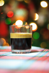 Cup of italian espresso coffee with Bokeh lights in background