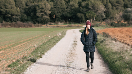 A young woman walking outdoor