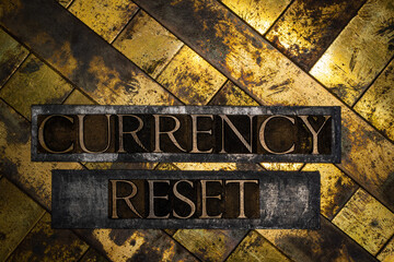 Currency Reset text message on textured grunge copper and vintage gold background