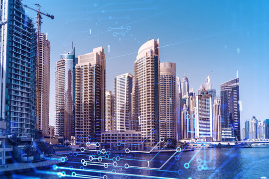 Skyscrapers of Dubai business downtown. International hub of trading and financial services. Technology theme icons hologram, concept of big data. Double exposure. Dubai Canal waterfront.