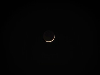 New moon sickle crescent lunar cycle shining glowing in black night sky universe above Cartagena de Indias Colombia © Marc