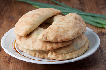 Homemade rustic pies with green onions and eggs