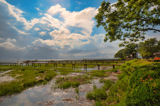 Docks protruding into Charleston, SC harbor with a beautiful sky, taken from Mount Pleasant, SC, USA.