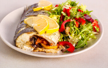 Sea bass fish with salad